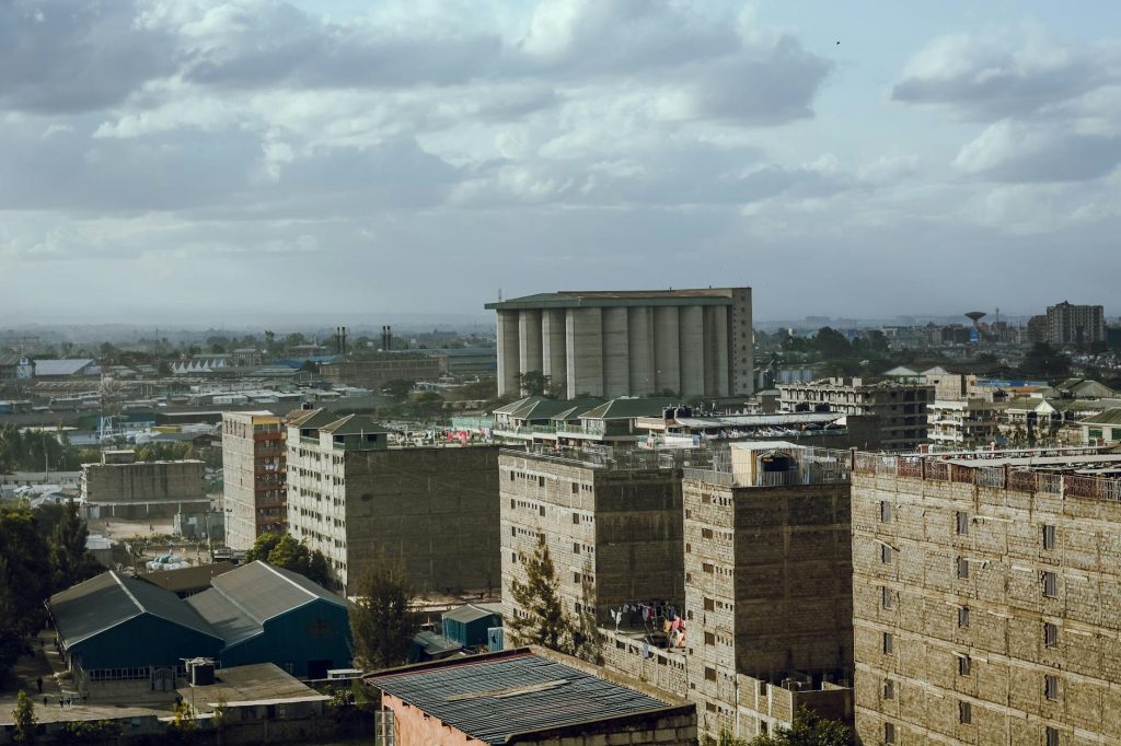 Industrial movers loading a truck outside a warehouse in Nairobi.