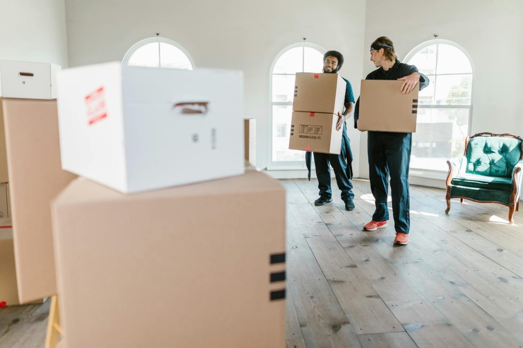 Professional movers loading furniture into a moving truck in Tassia, Nairobi.