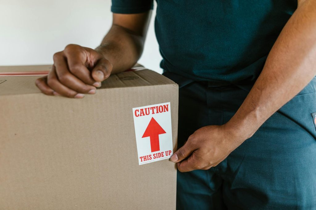 Professional movers loading furniture into a moving truck in Nairobi.